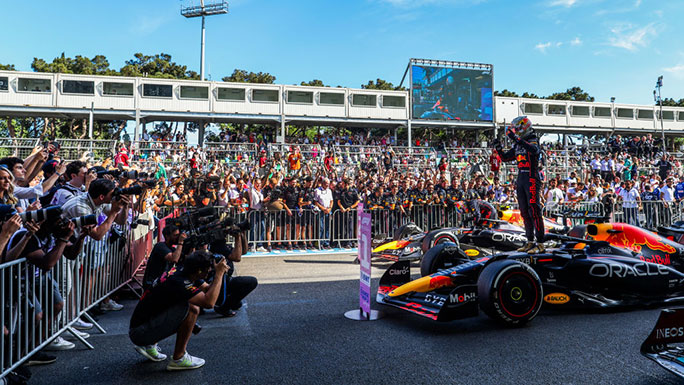 A race winner celebrates as part of a larger hospitality event