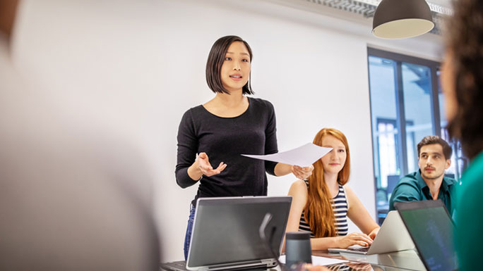 A hospitality graduate giving a talk